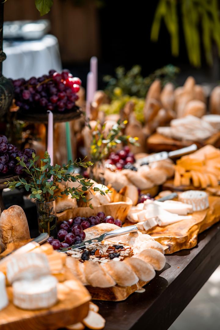 Buffet with white orchids and pastries